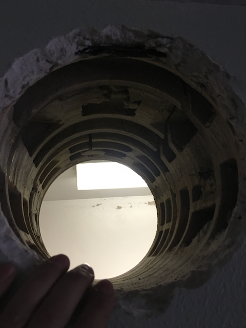 Challenging hole through clay tile block wall