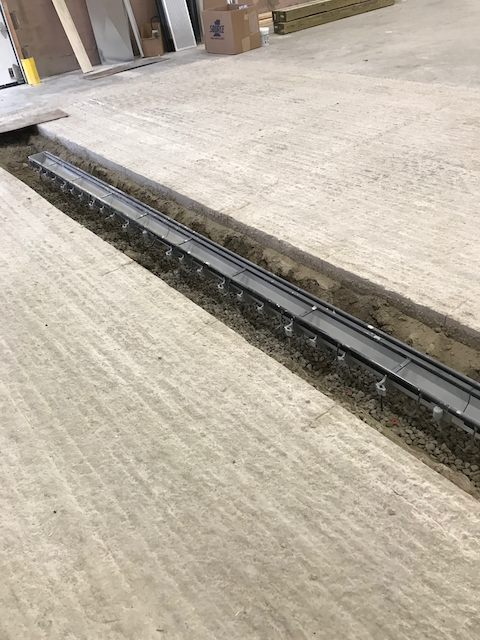 New trench drain in concrete slab